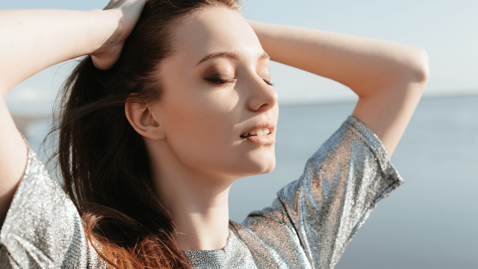 woman with hands in her hair